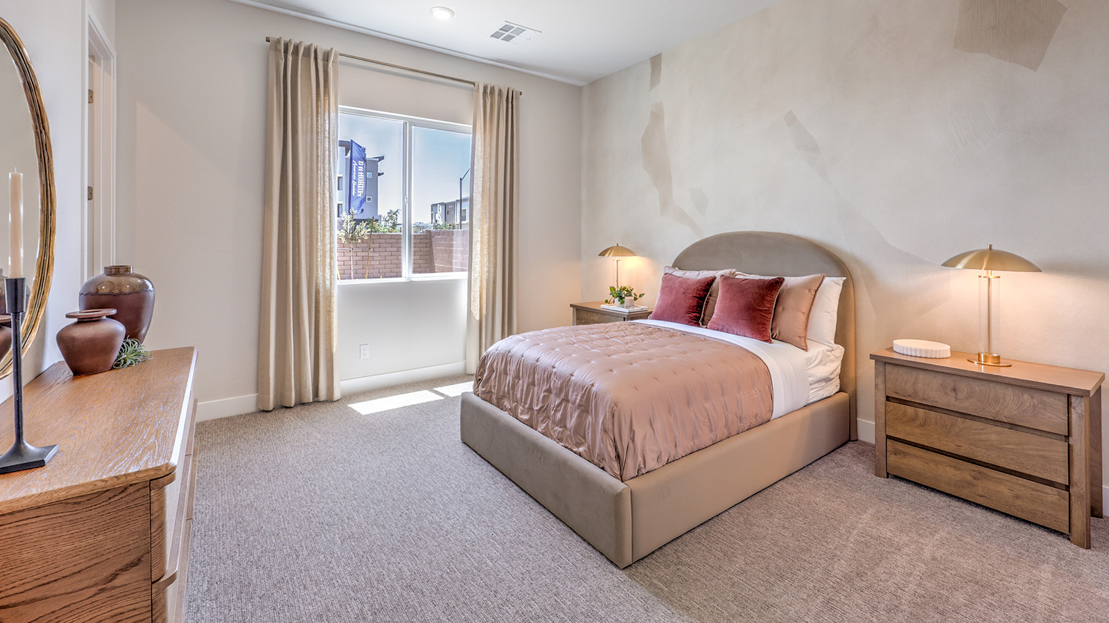 Bedroom Six in our Heartland Summit 4418 Multigen Suite with carpet flooring, a walk-in closet, and a window.