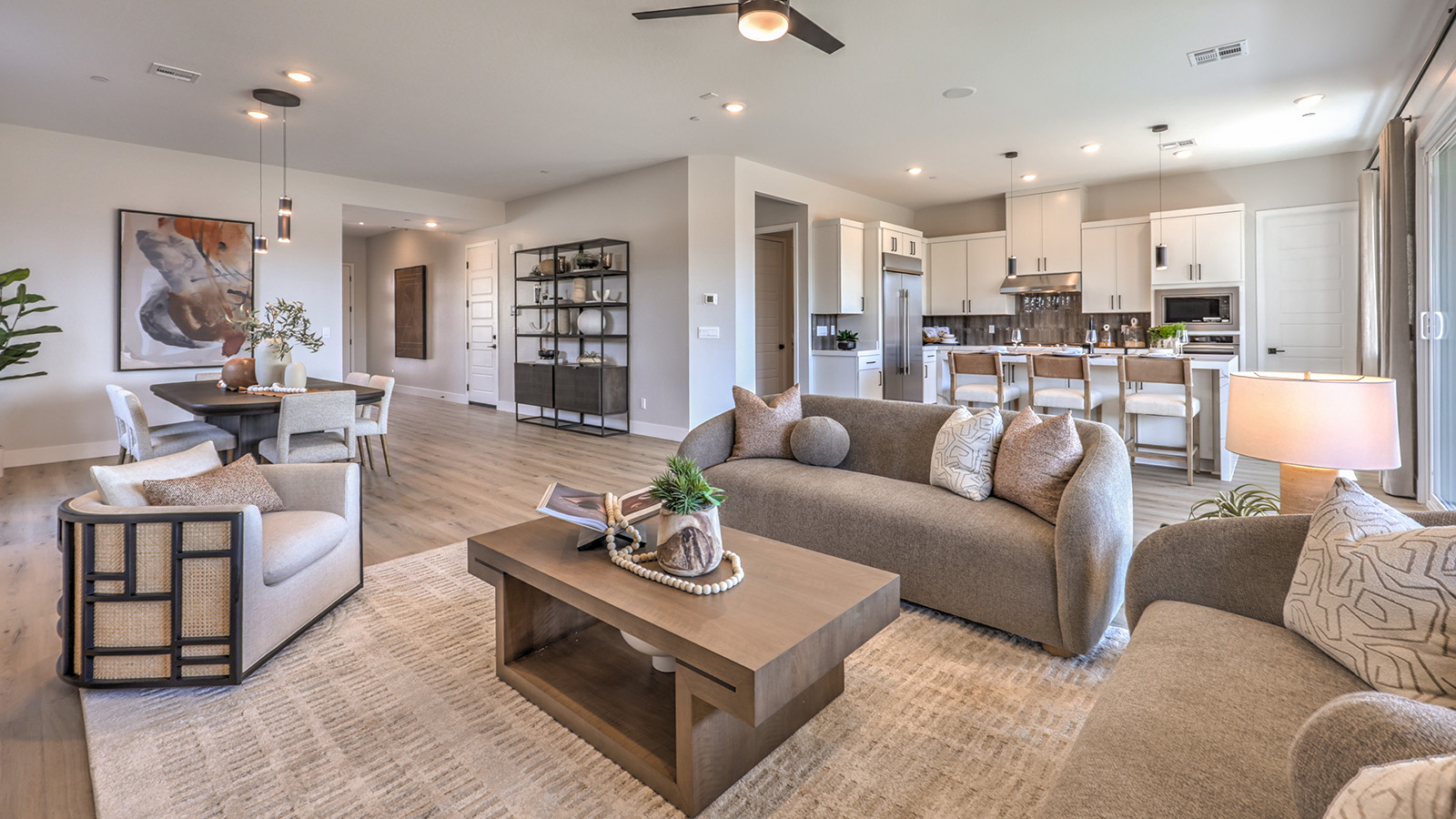 The Heartland Summit 3774 Plan open concept Great Room with ceramic tile flooring and large windows.