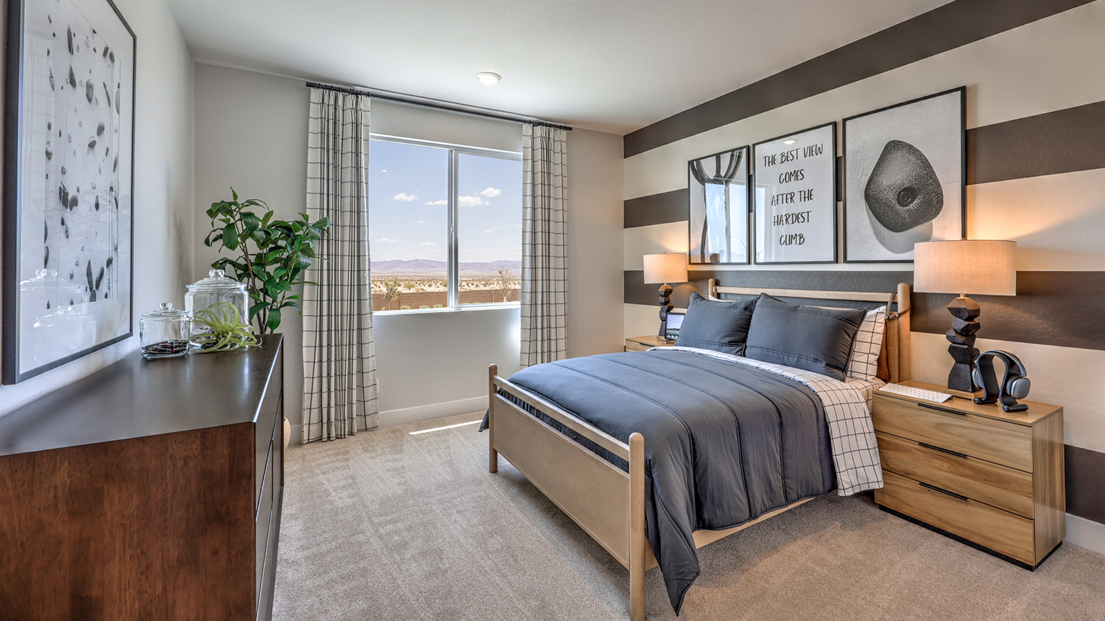 Bedroom Four in our Heartland Summit 3774 model with carpet flooring, a walk-in closet, and a window.