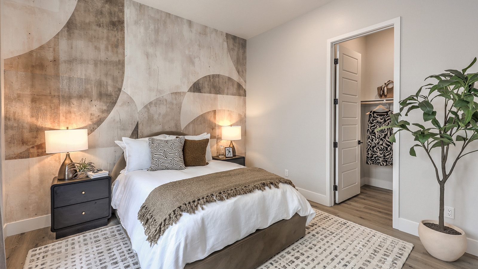 Bedroom Five in our Heartland Summit 3774 Multigen Suite with carpet flooring, a walk-in closet, and a window.