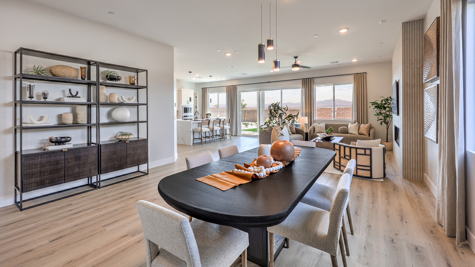 The Heartland Summit 3774 model Dining Room adjacent to the kitchen and great room with a table and large window.