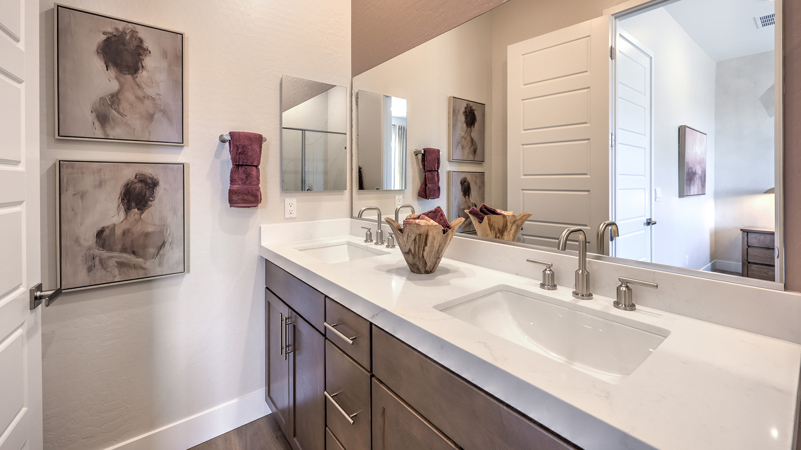 Bathroom Four in our Heartland Summit 4418 Multigen Suite with granite countertops at the Bath Vanity, a walk-in shower, mirror, and brown cabinets.