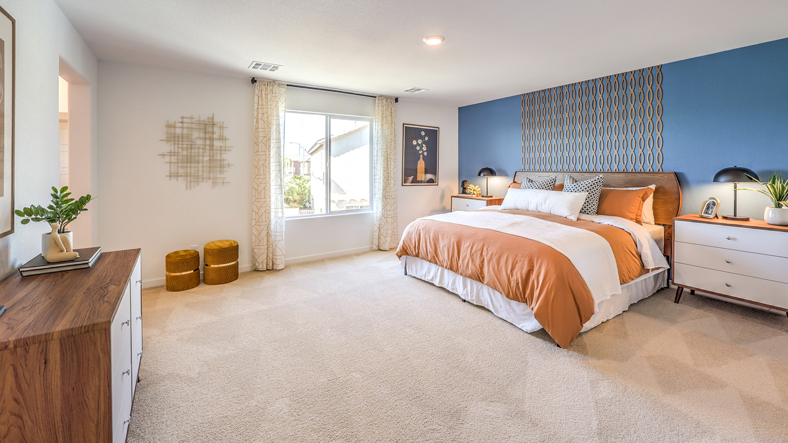 The Bedroom One Suite in our Tropical Falls 2660 model with carpet flooring and large windows.