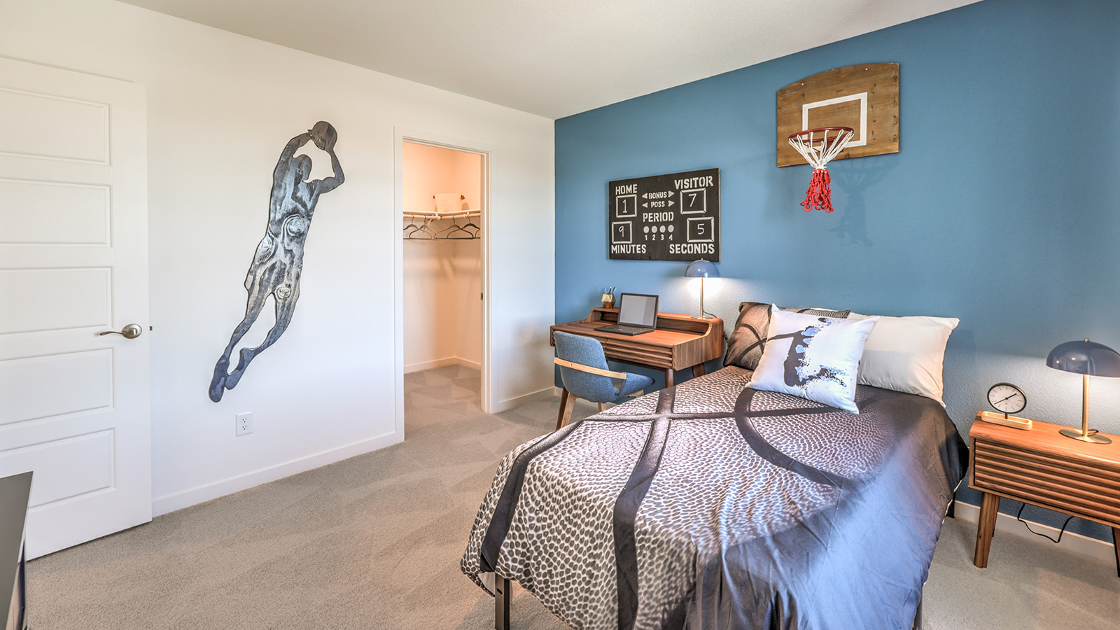 Bedroom Two in our Tropical Falls 2660 model with carpet flooring, a walk-in closet, and a window.
