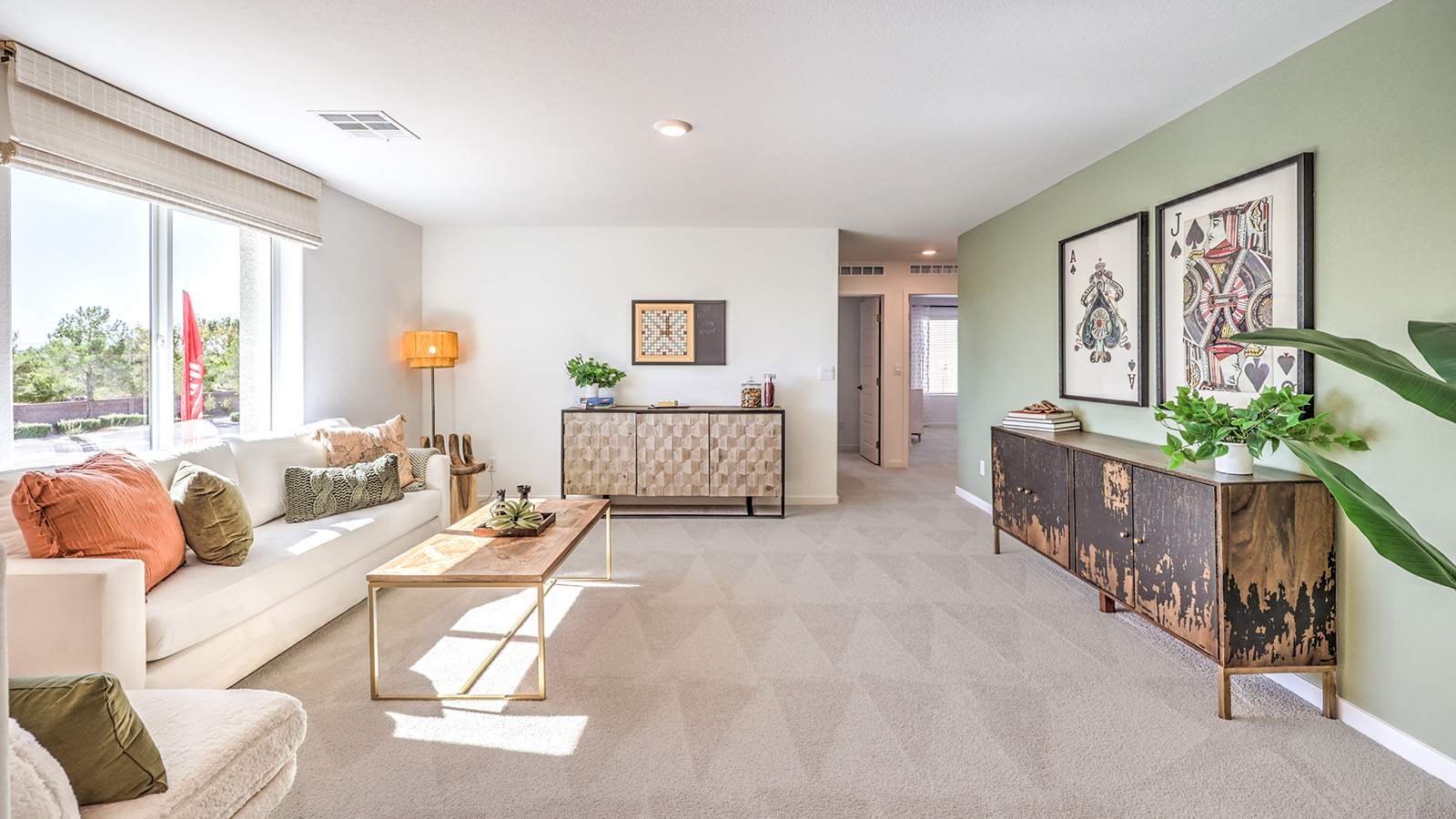The Tropical Falls 3000 Model Loft featuring wall-to-wall carpet, recessed lighting, and an open layout ideal The space is located on the upper level and offers flexibility for a variety of lifestyle needs, with natural light from adjacent rooms enhancing the bright, airy feel.