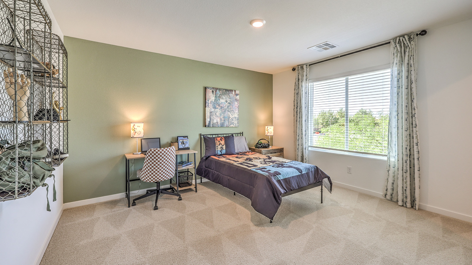 The Tropical Falls 3000 Model Second Bedroom with plush wall-to-wall carpet, large window for natural light, and a spacious layout designed for comfort. This secondary bedroom offers a quiet retreat with easy access to a nearby full bathroom, making it ideal for family members or guests.