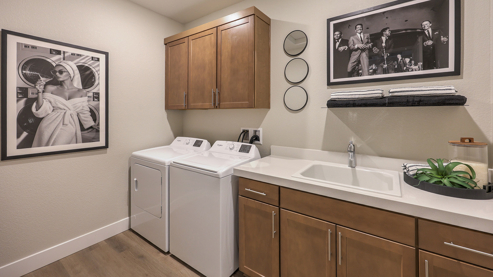 Our Majestic Hills 2390 model laundry room with a shelf and washer and dryer.