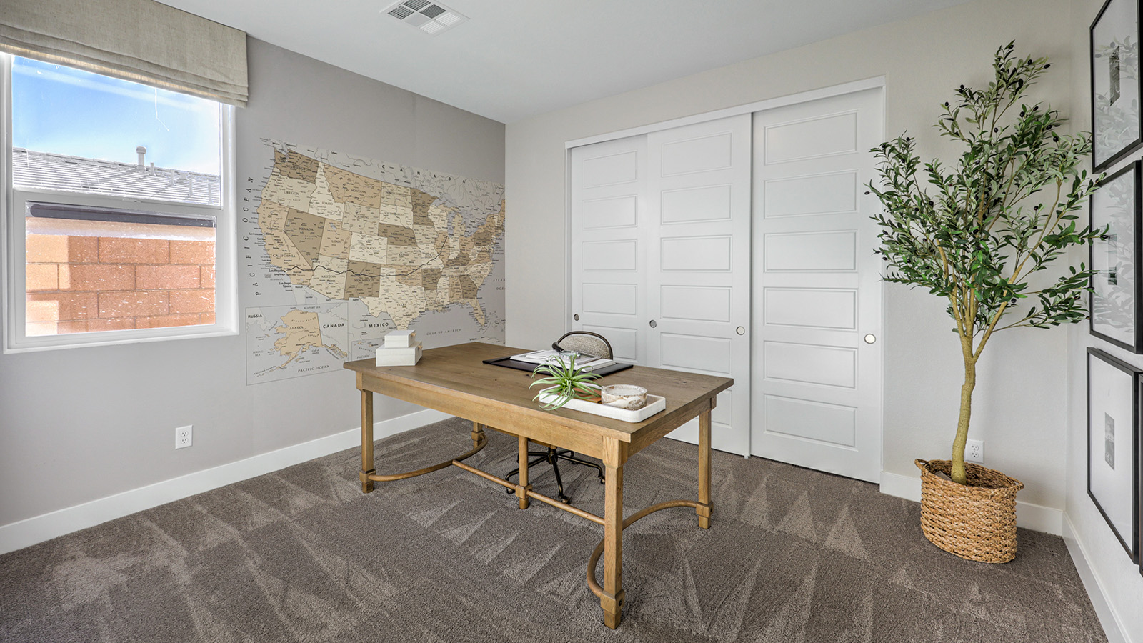 The Majestic Hills 2650 Plan Bedroom 3 featuring plush wall-to-wall carpet, a wide window for natural light, and a double-door closet for convenient storage. This versatile room offers a comfortable layout suitable for a guest room, children’s room, or home office.