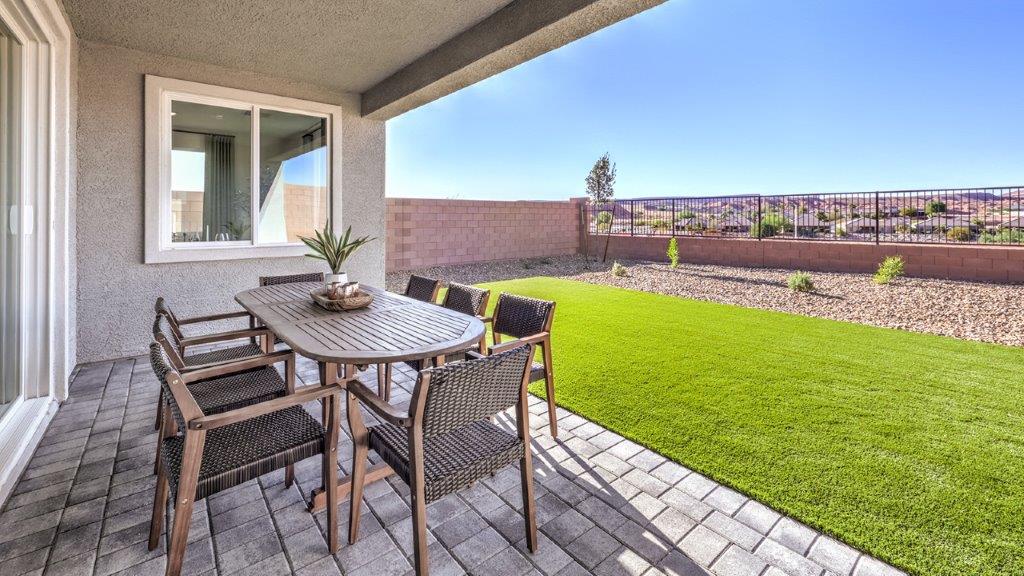 Our Majestic Hills 2650 model backyard with desert landscaping and a seating area.