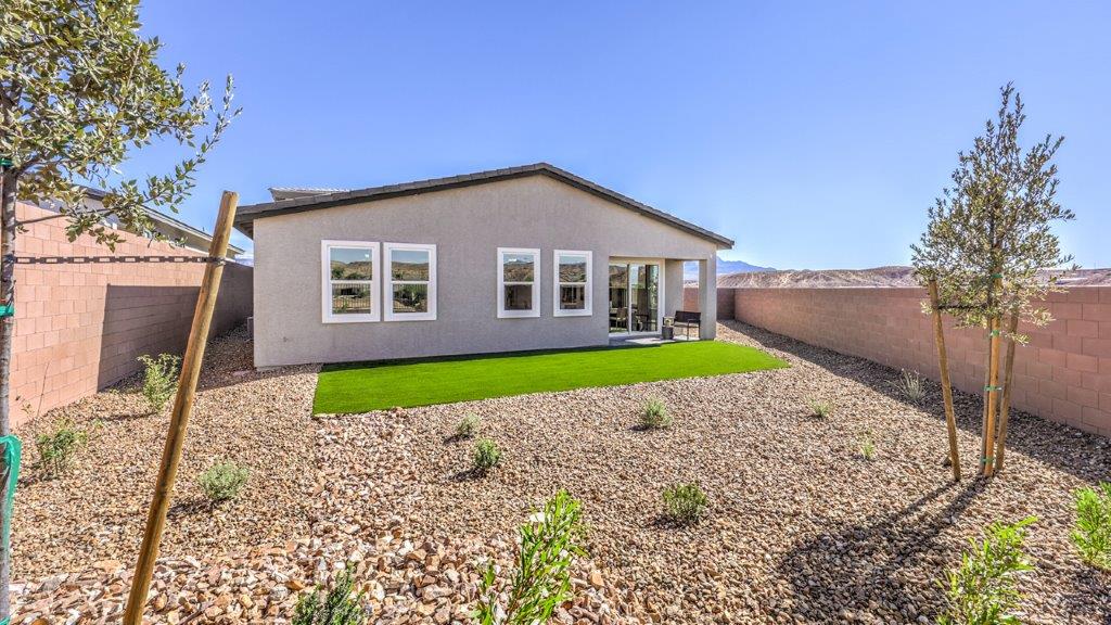 Our Majestic Hills 1870 model backyard with desert landscaping and a seating area.