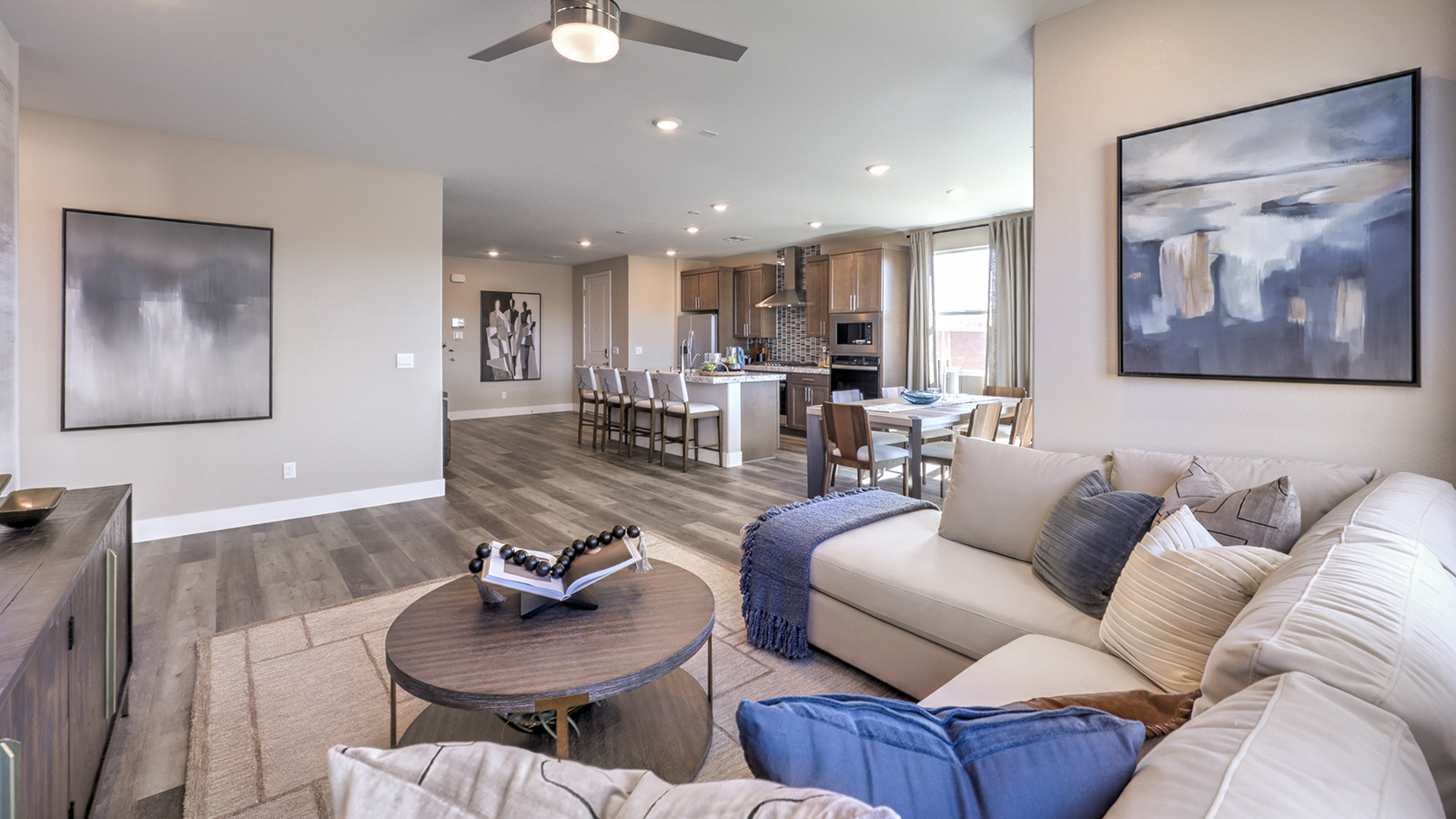 The Majestic Hills 1870 Plan open concept Great Room with LVP panel flooring and a large window.