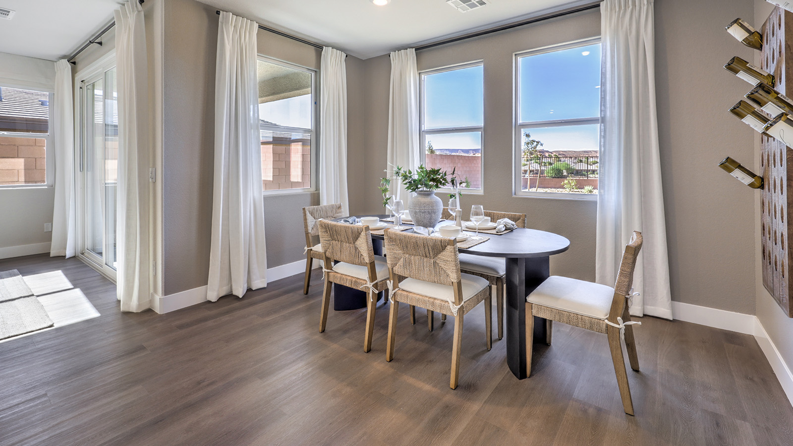 The Majestic Hills 1617 model Dining Room adjacent to the kitchen with a table and window.