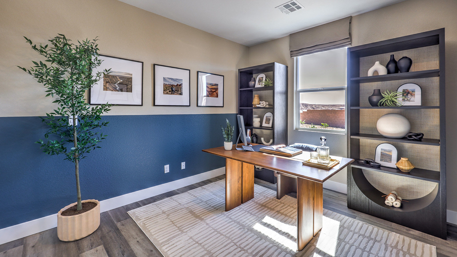 The Office/Bedroom Two option in our Majestic Hills 1870 model with carpet flooring and a window, furnished with a desk and chair.