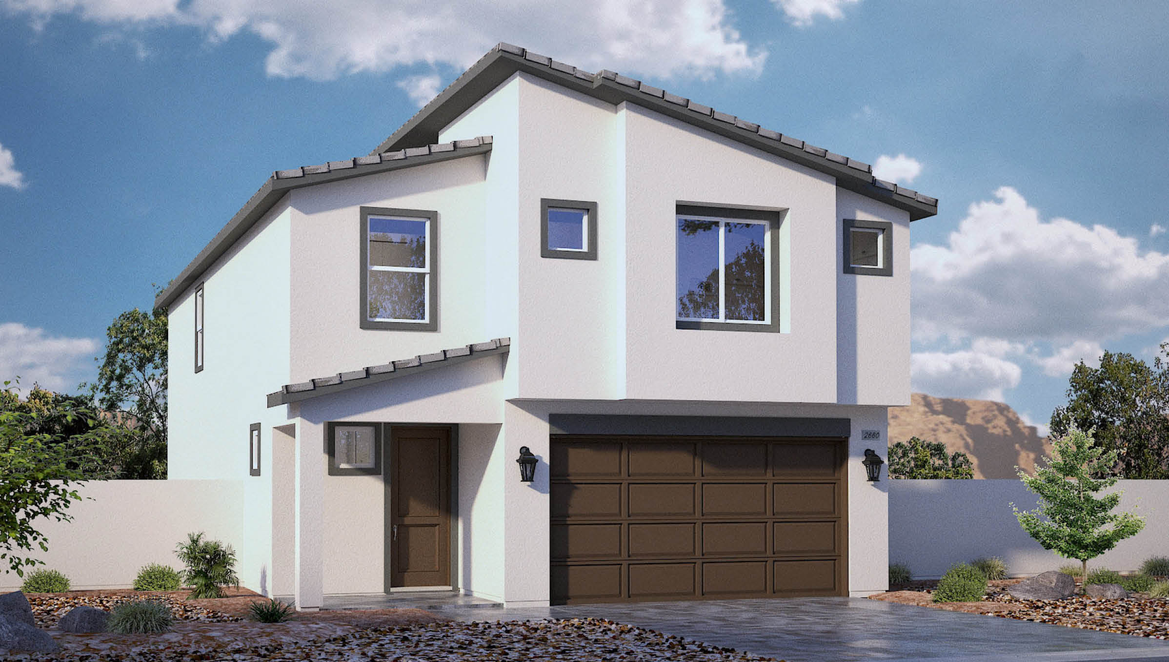 Our 2660  model home in the Sky Falls community with white and brown exterior paint schemes, a flat tile roof, 2-car garage, front yard landscaping, and paver walkways.