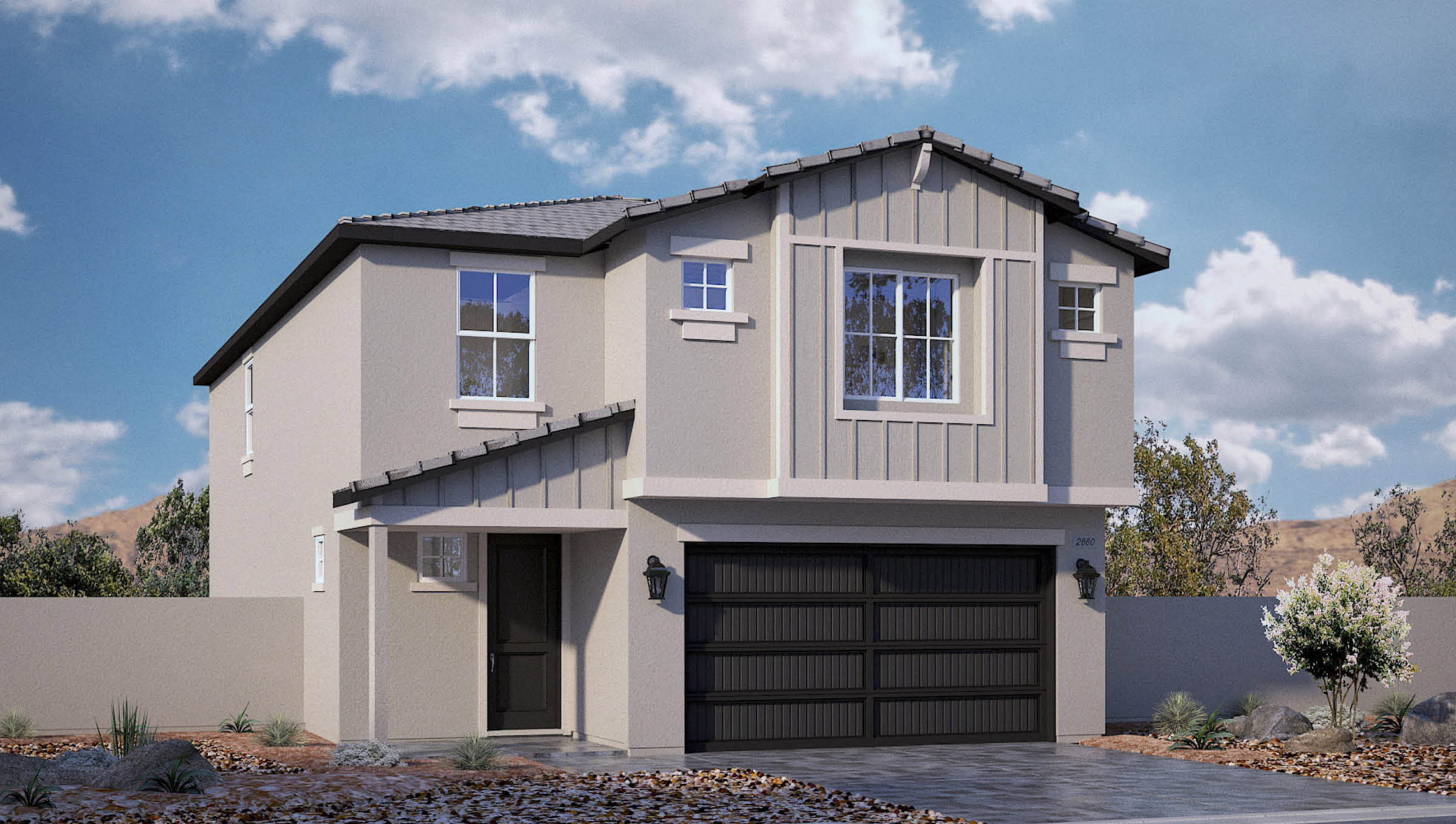 Our 2660 model home in the Sky Falls community with grey and green exterior paint schemes, a flat tile roof, 2-car garage, front yard landscaping, and paver walkways.