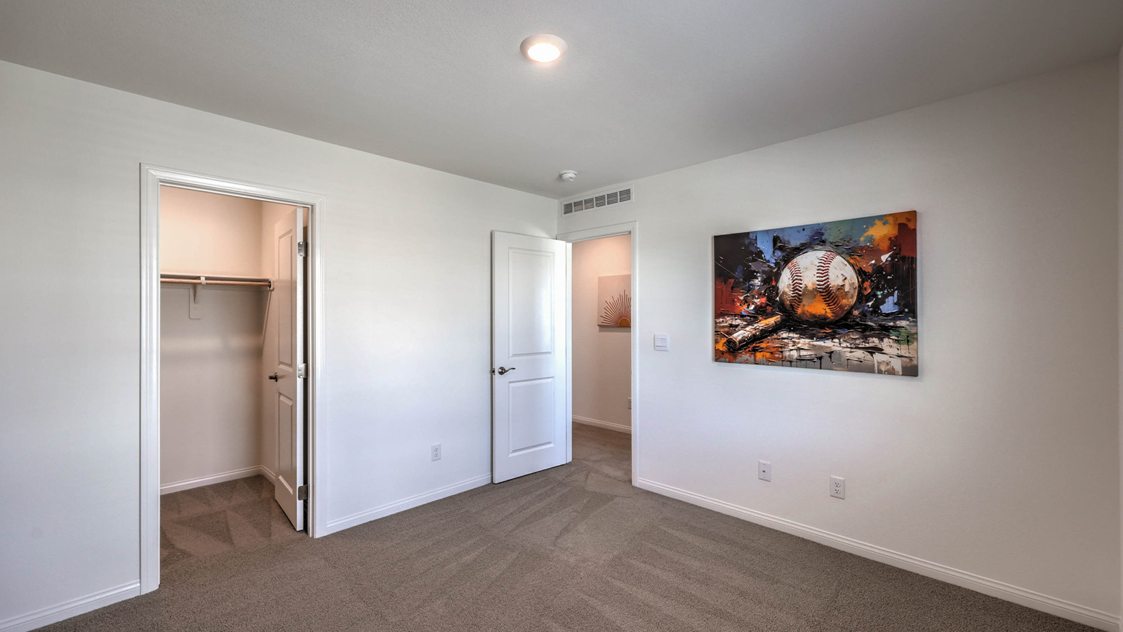 Bedroom Two in our Sky Falls 2660 model with carpet flooring, a sliding closet, and a window.