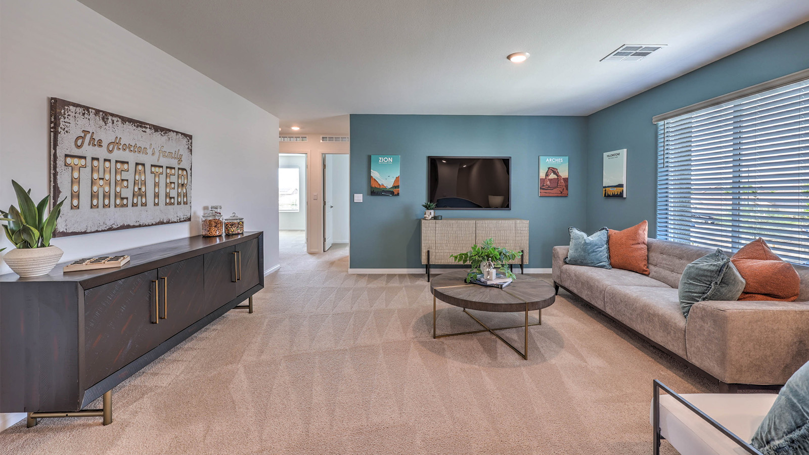 The upstairs loft in our 3000 model with carpet flooring and large windows.