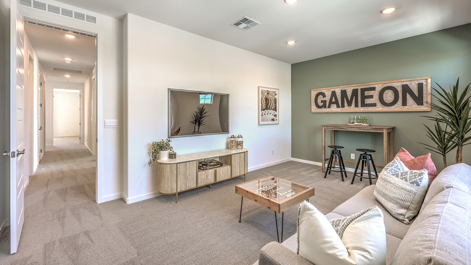 The upstairs loft in our 2600 model with carpet flooring and large windows.