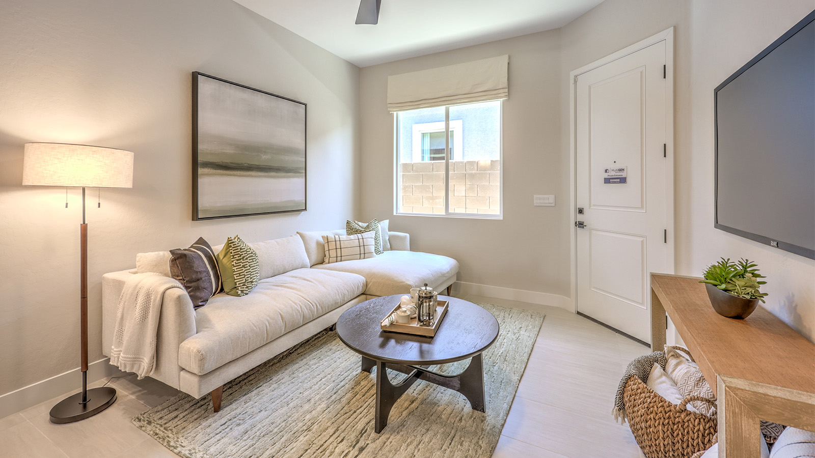 The MultiGEN suite in our Heartland Manor 2754 Plan features luxury vinyl plank flooring, a spacious living area, and a private entry for added flexibility. This suite includes a kitchenette for convenience and easy access to a private bathroom. Designed for multi-generational living, it offers a comfortable and independent space within the home.