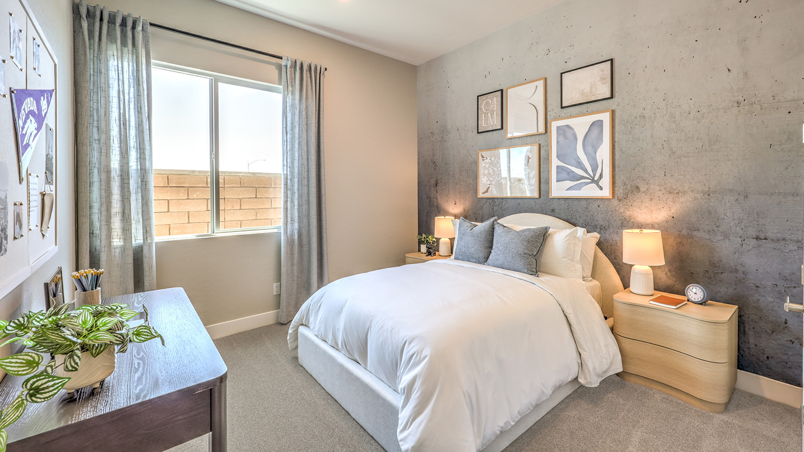 The second bedroom in our Heartland Manor 2538 Plan features plush carpet flooring, a spacious layout, and a large window that fills the room with natural light. The room offers a comfortable and inviting space, perfect for guests or family members.