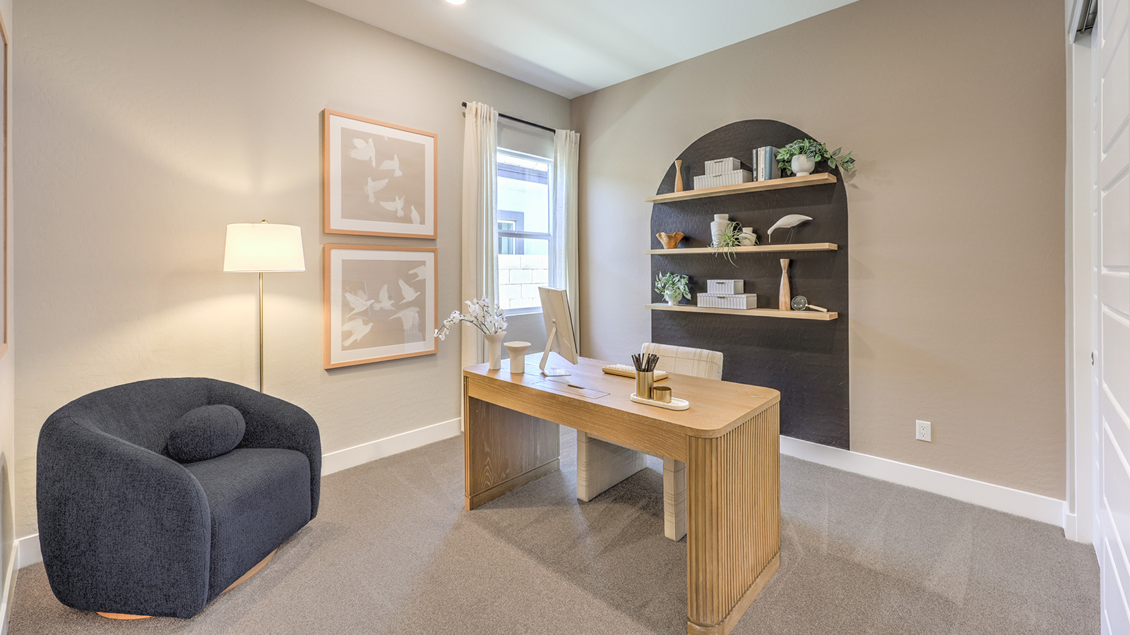 The third bedroom in our Heartland Manor 2538 Plan features plush carpet flooring, a spacious layout, and a large window for natural light. With a standard closet and ample space, this versatile room can be used as a bedroom or a home office to fit your needs.
