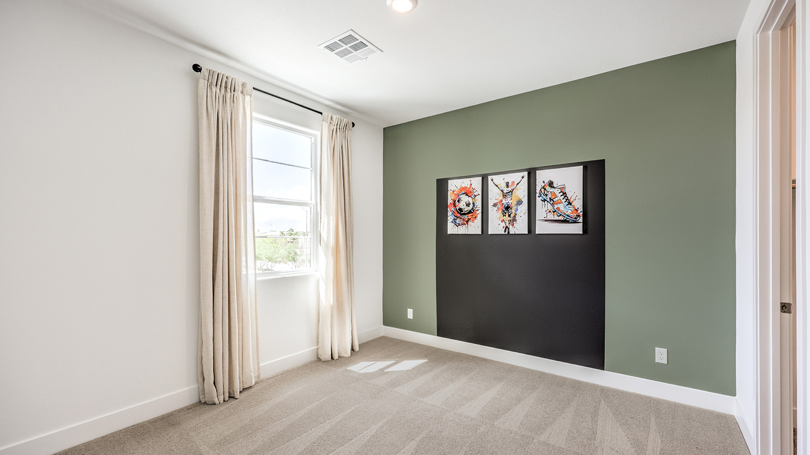 The Office/Bedroom Five option in our Serenity 2600 model with carpet flooring and a sliding closet, furnished with a desk and chair.