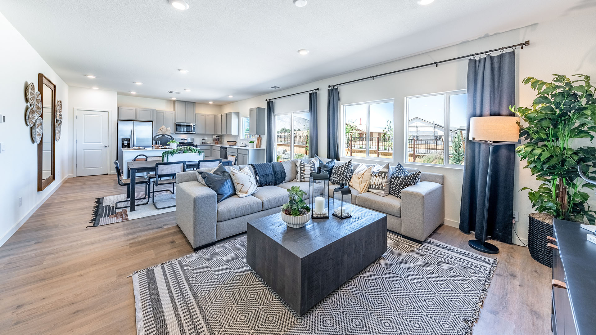 Open concept living area with large windows and bright atmosphere