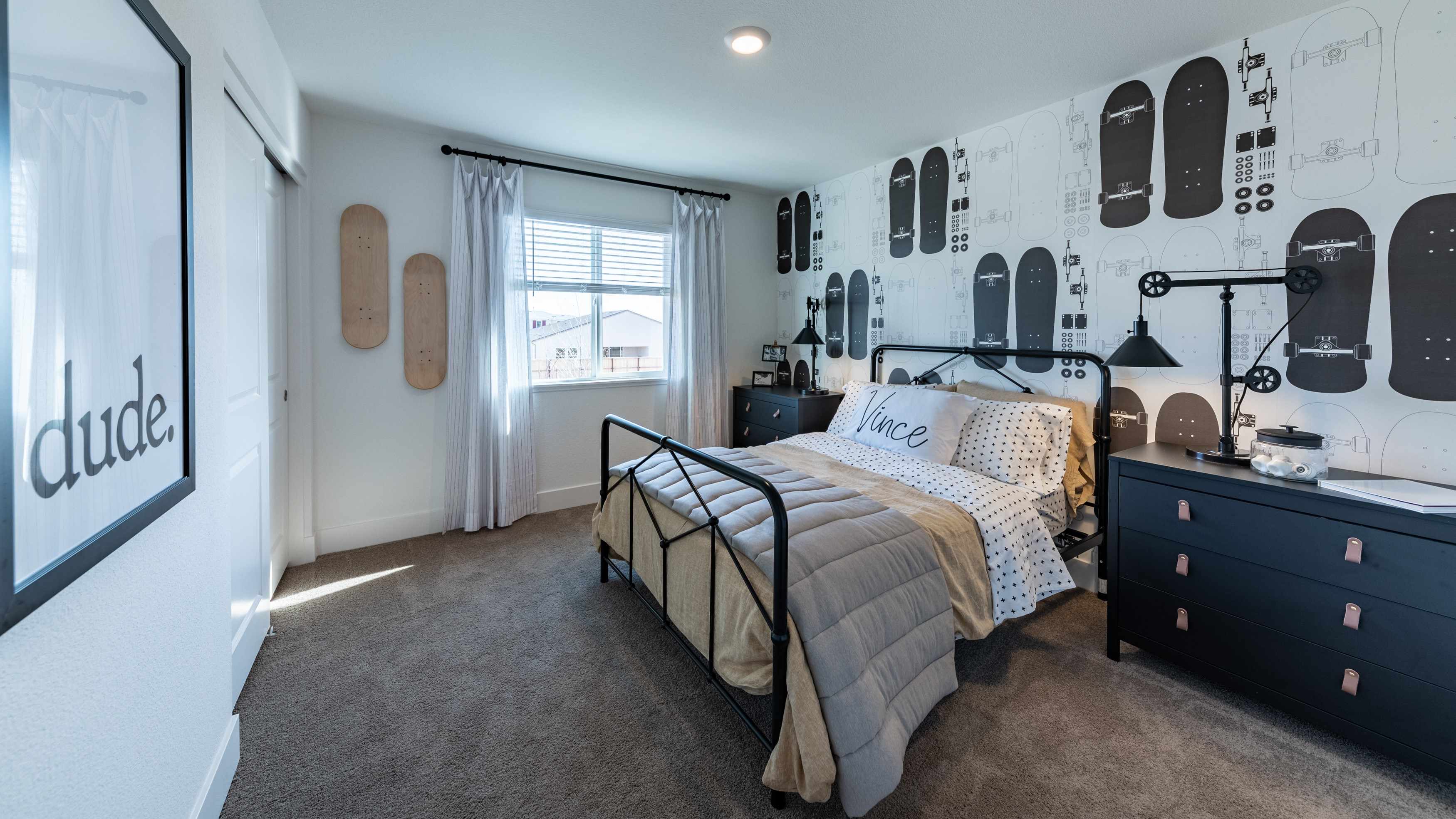 Secondary bedroom with carpet decorated for a teen