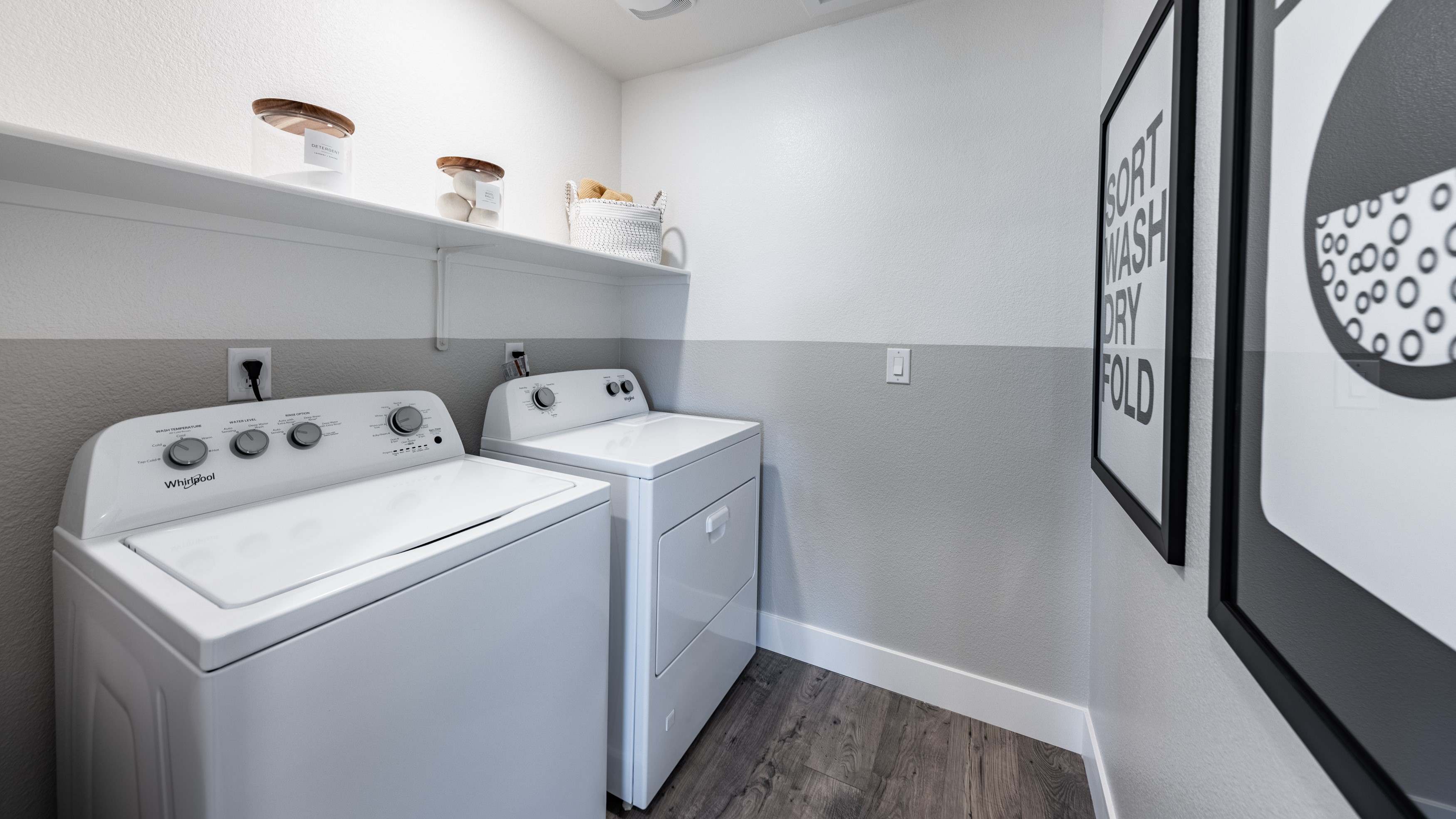 Laundry room with shelf above washer and dryer
