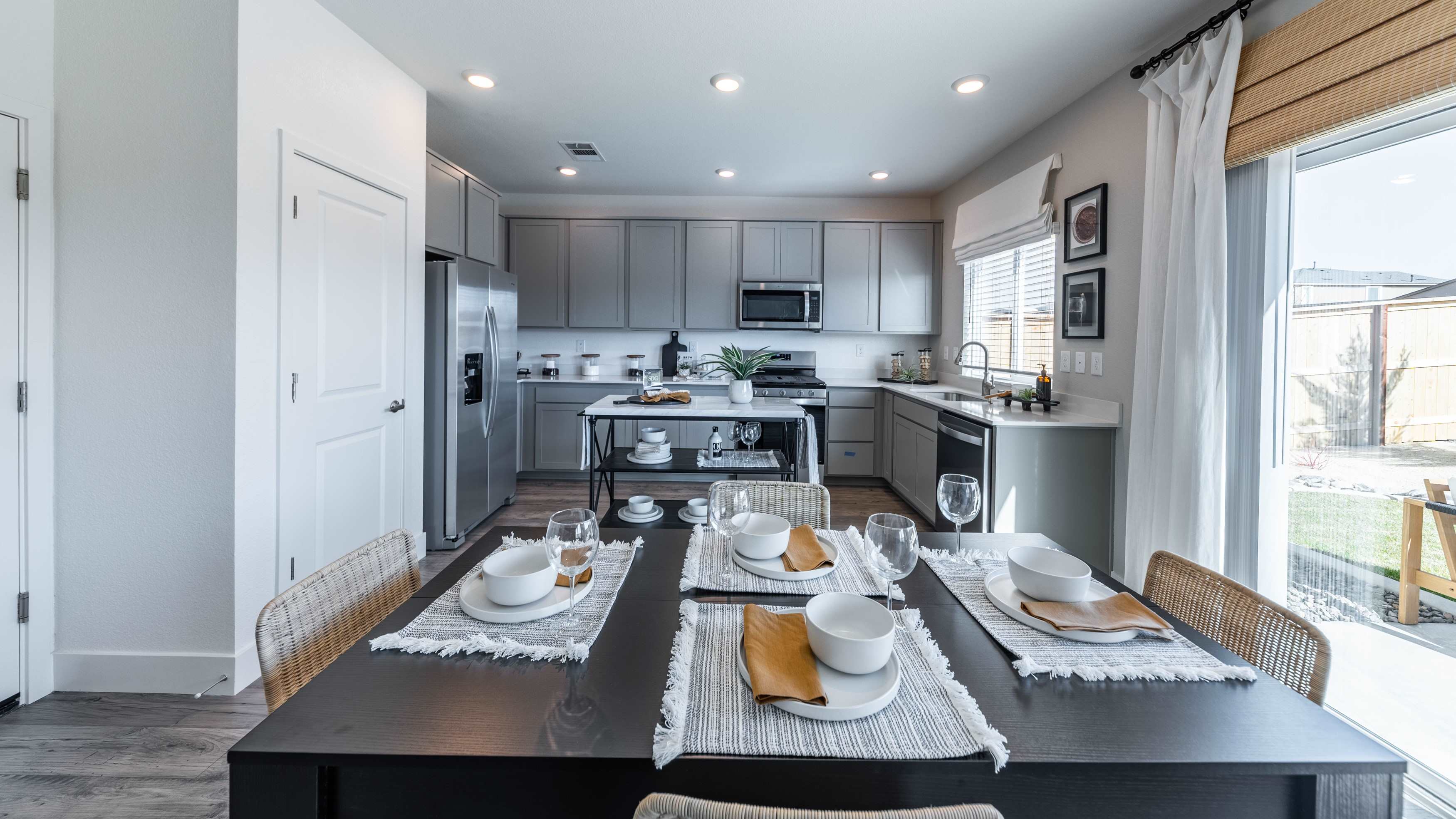 Dining table next to backyard door and kitchen