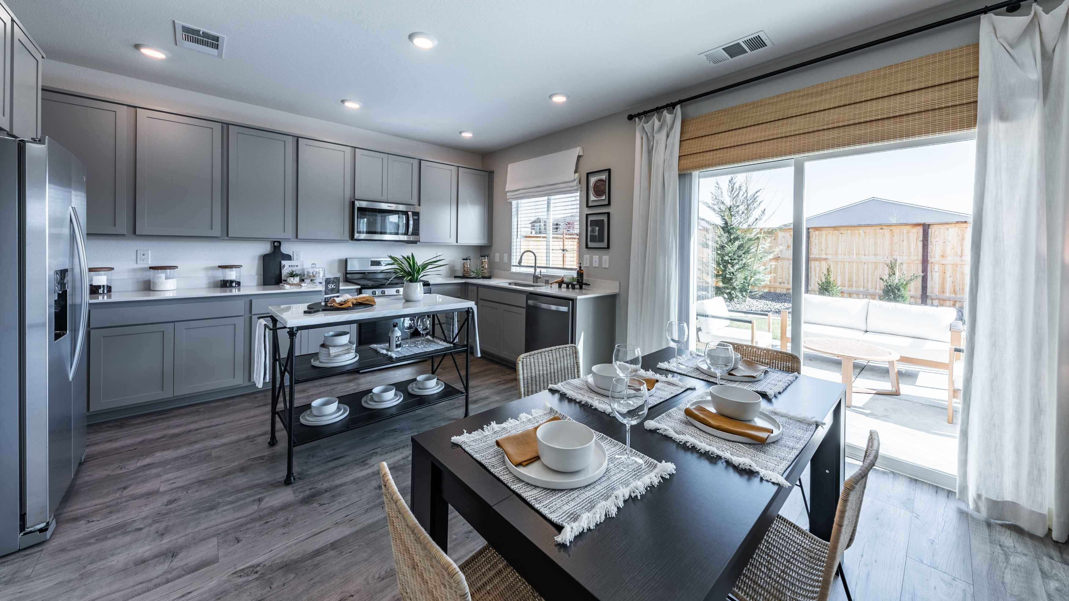 Kitchen and dining area next to back patio door