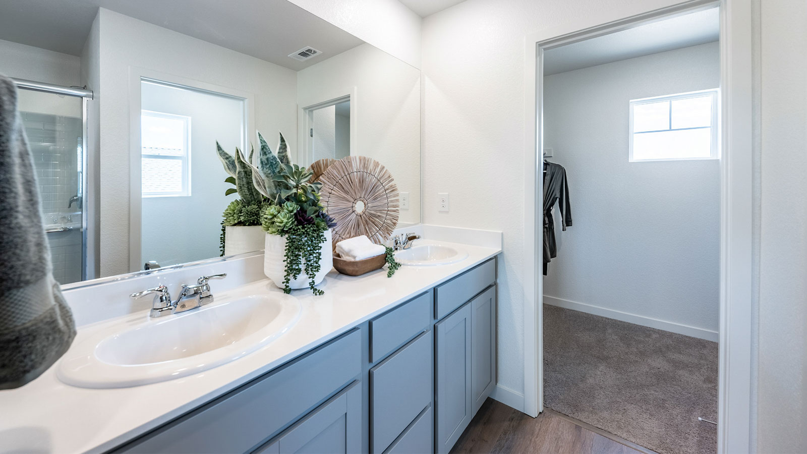 Primary bathroom with shower and large walk-in closet