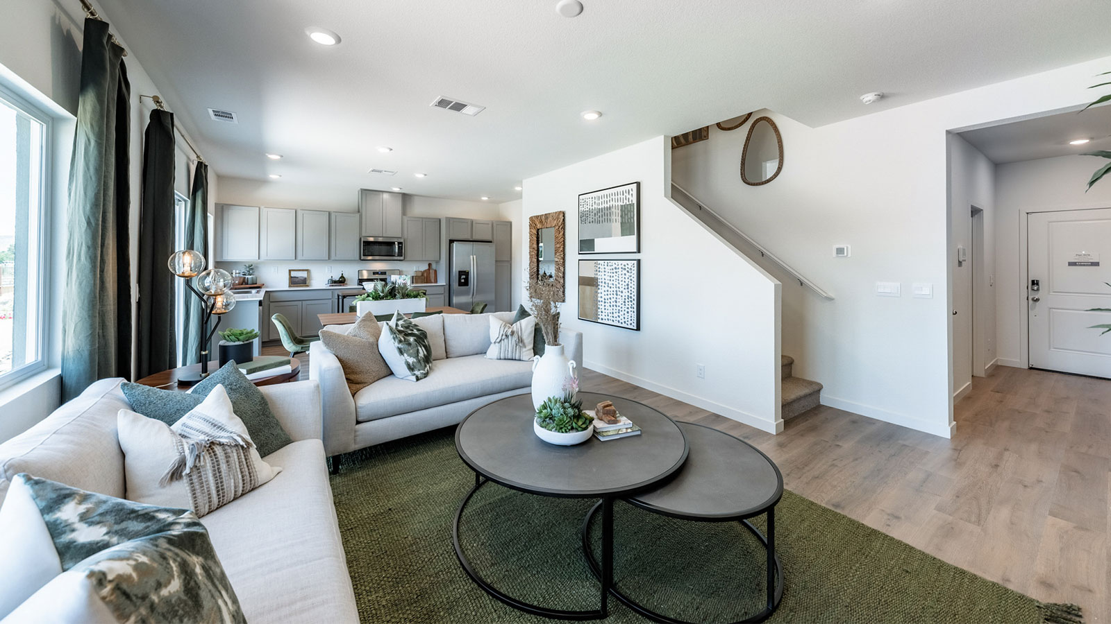 Modern open concept living room design with staircase