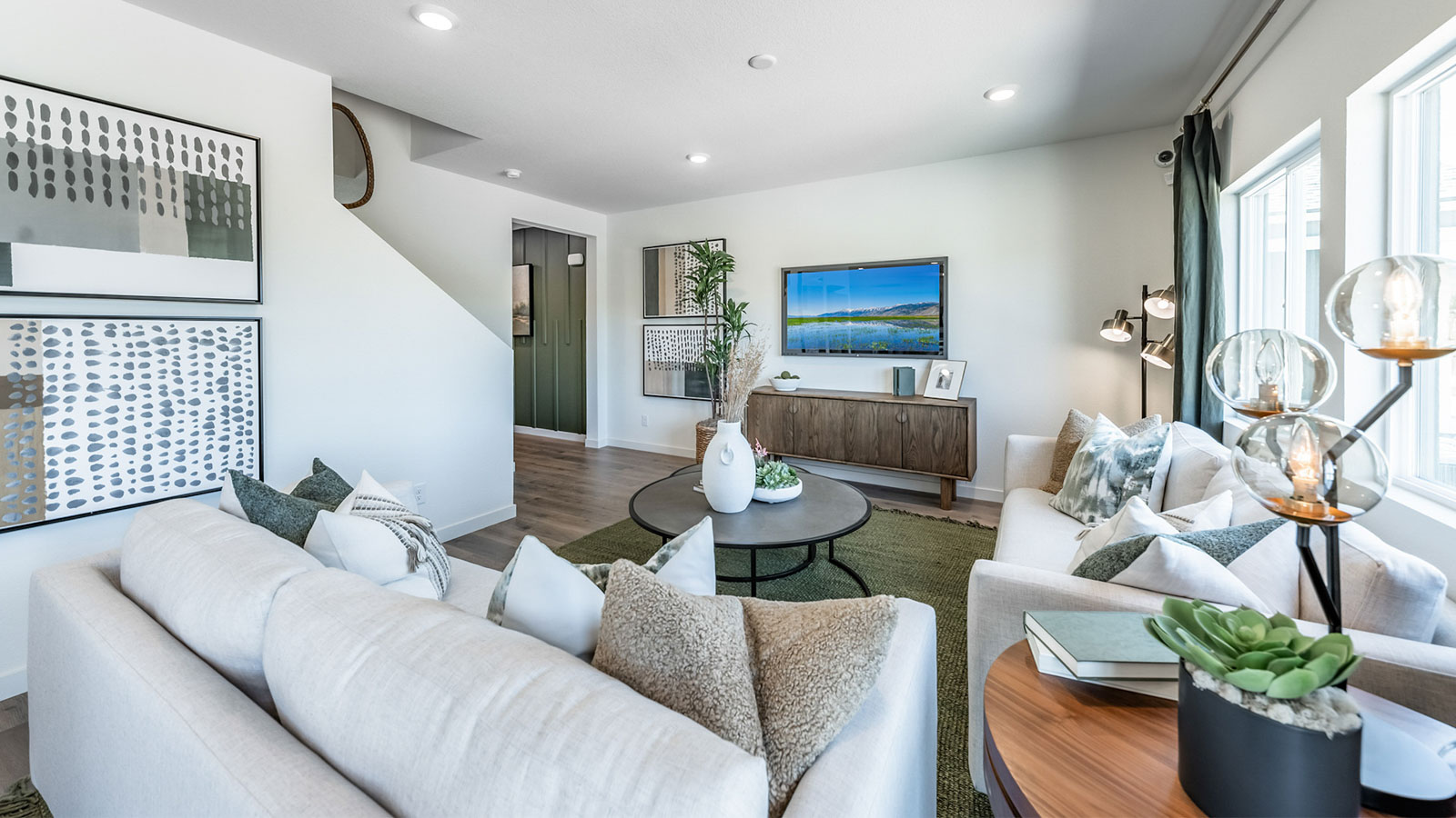 Living room space with large windows to let in natural light