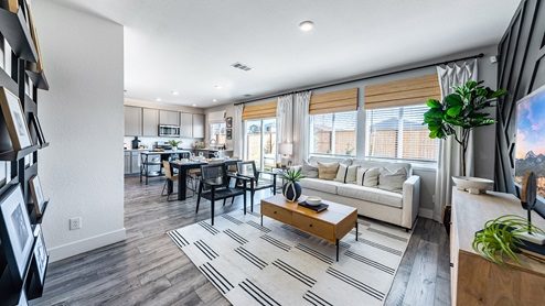 Open concept living area with large windows