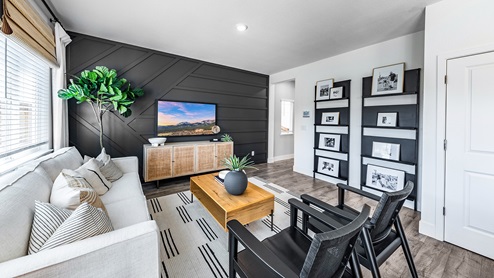 Modern living room with bright natural light and modern decor