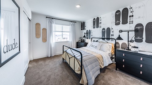 Secondary bedroom with carpet decorated for a teen