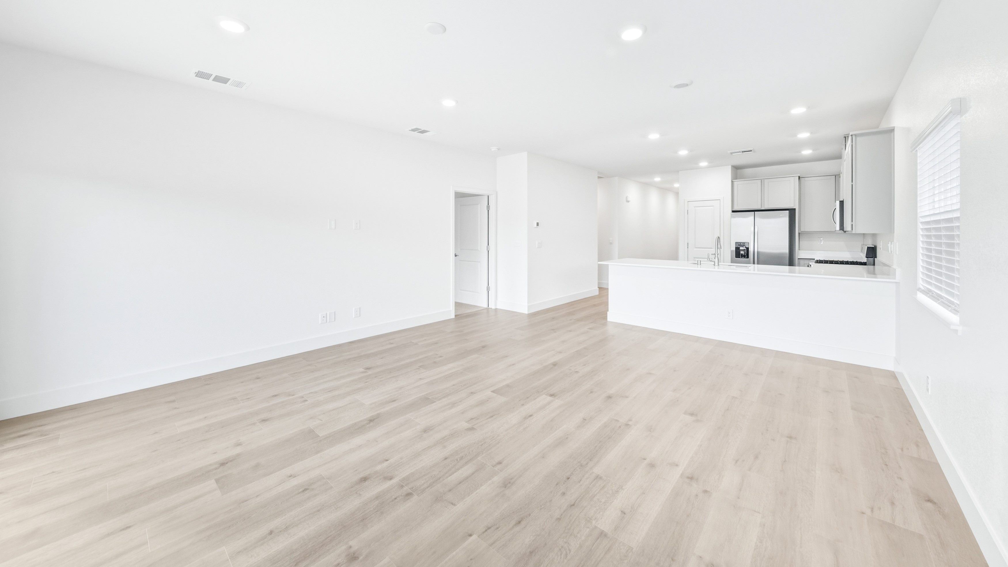 Open concept great room with natural light