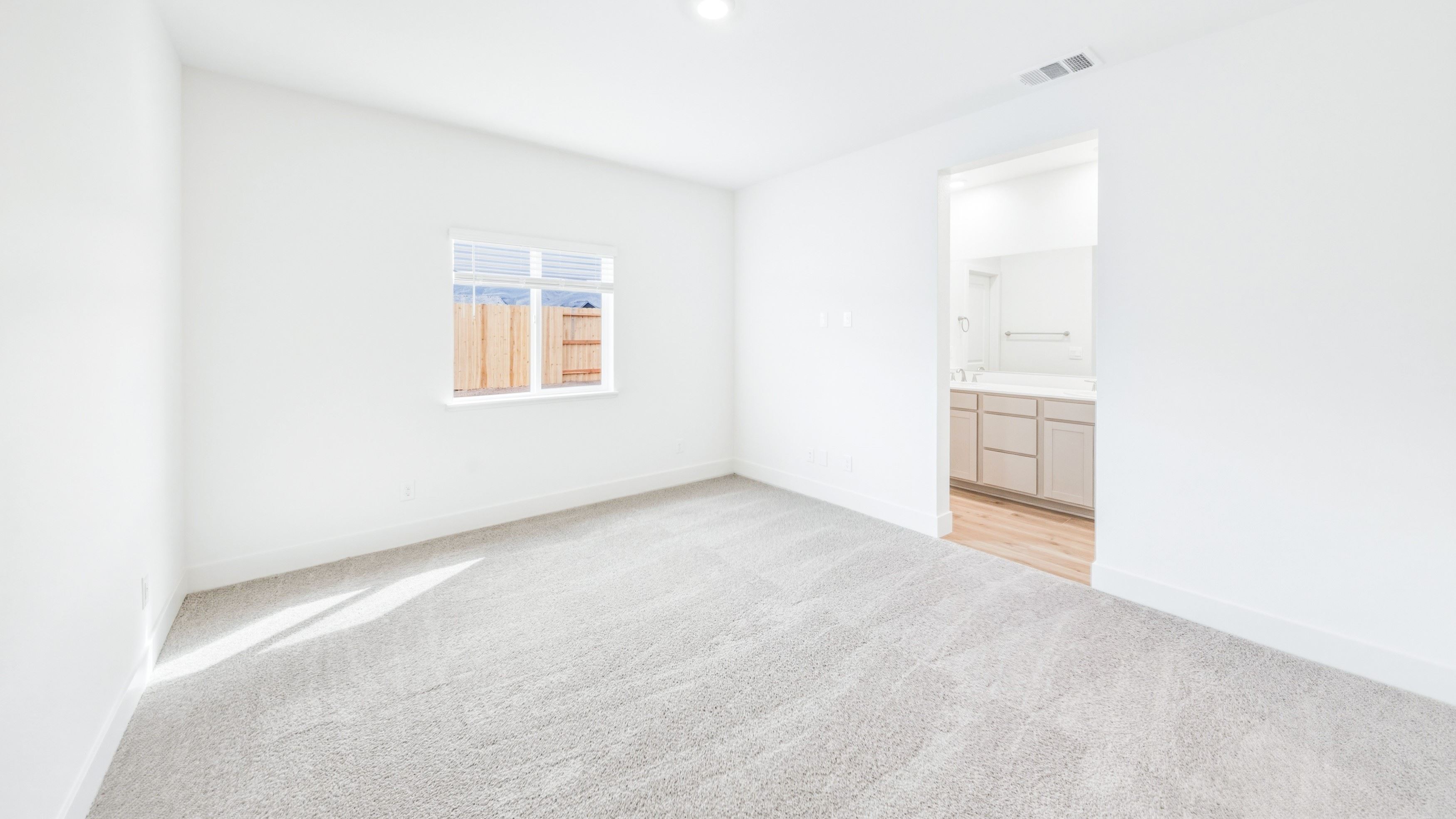 Primary bedroom with a large window