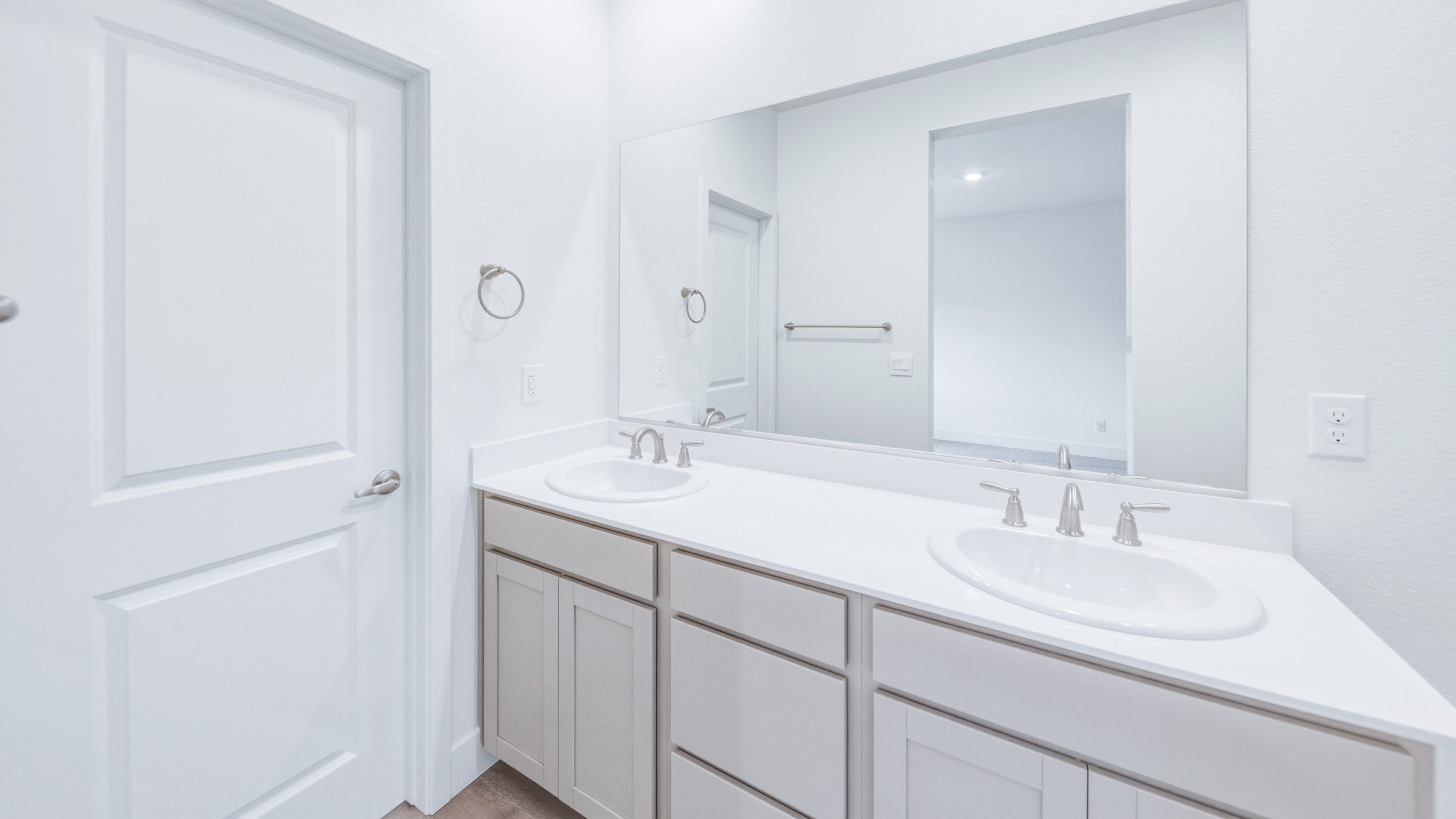 Primary with dual sinks and a private bathroom