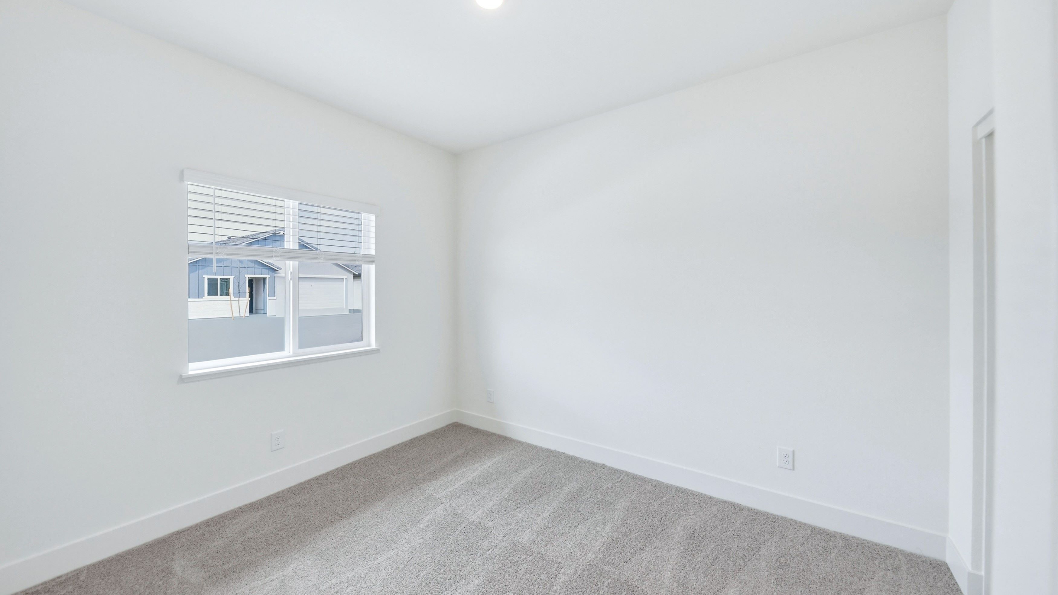 Carpeted secondary bedroom