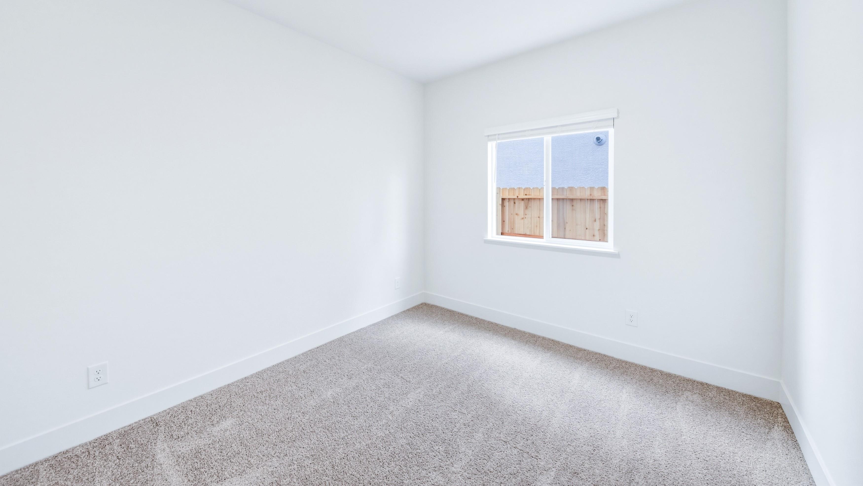 Carpeted secondary bedroom