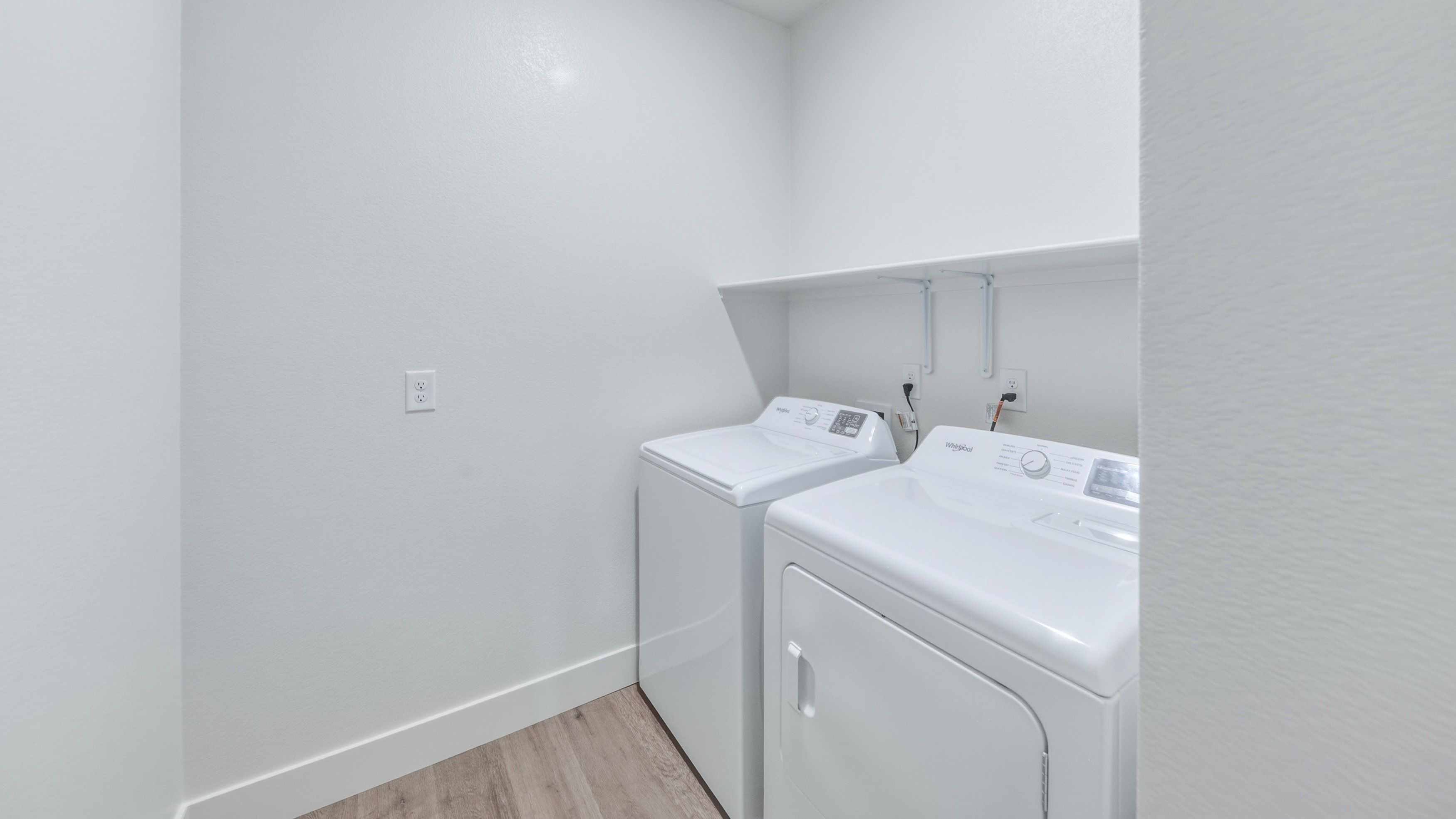 Laundry room with shelving