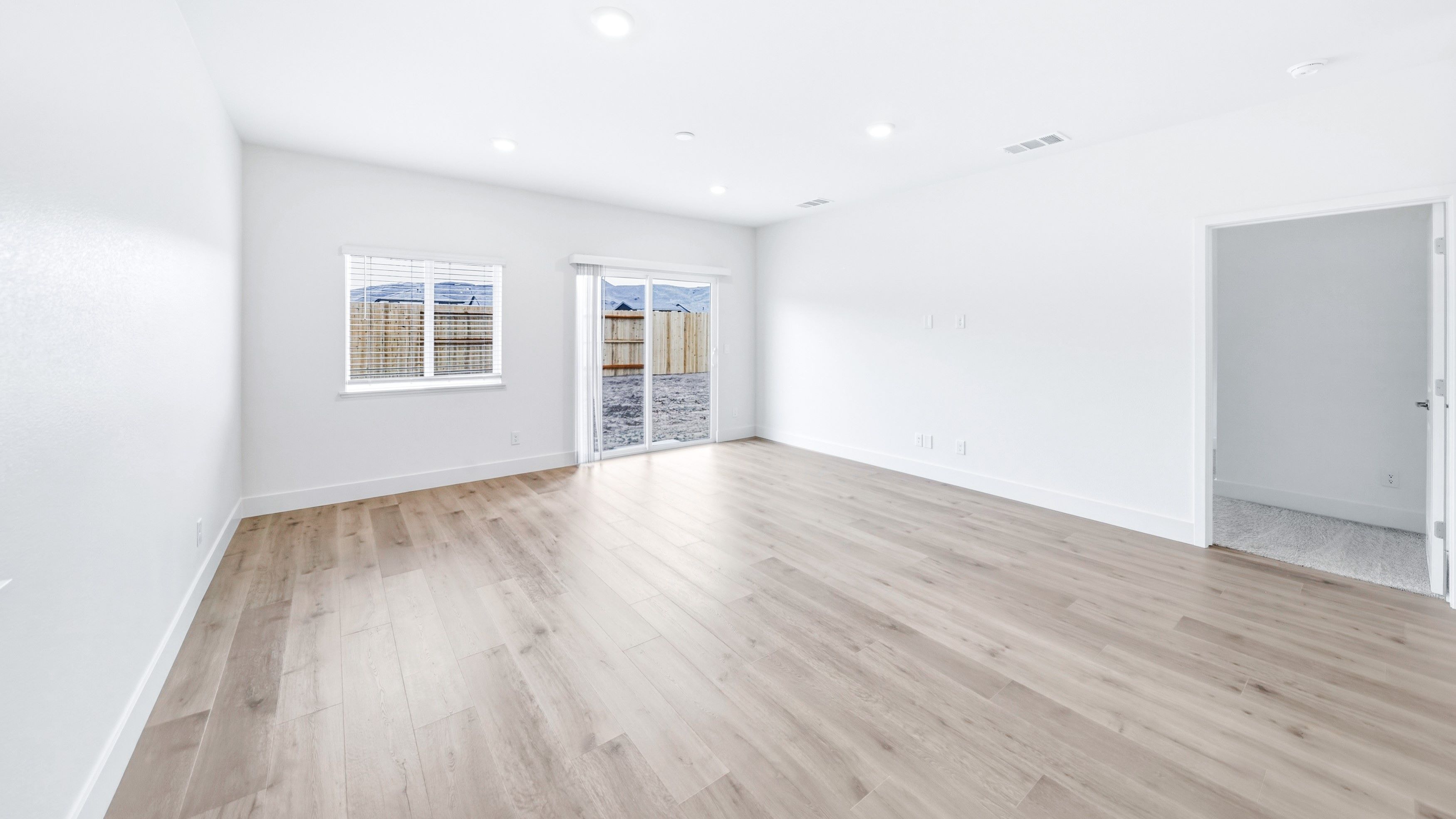 Open concept great room looking out towards the back patio
