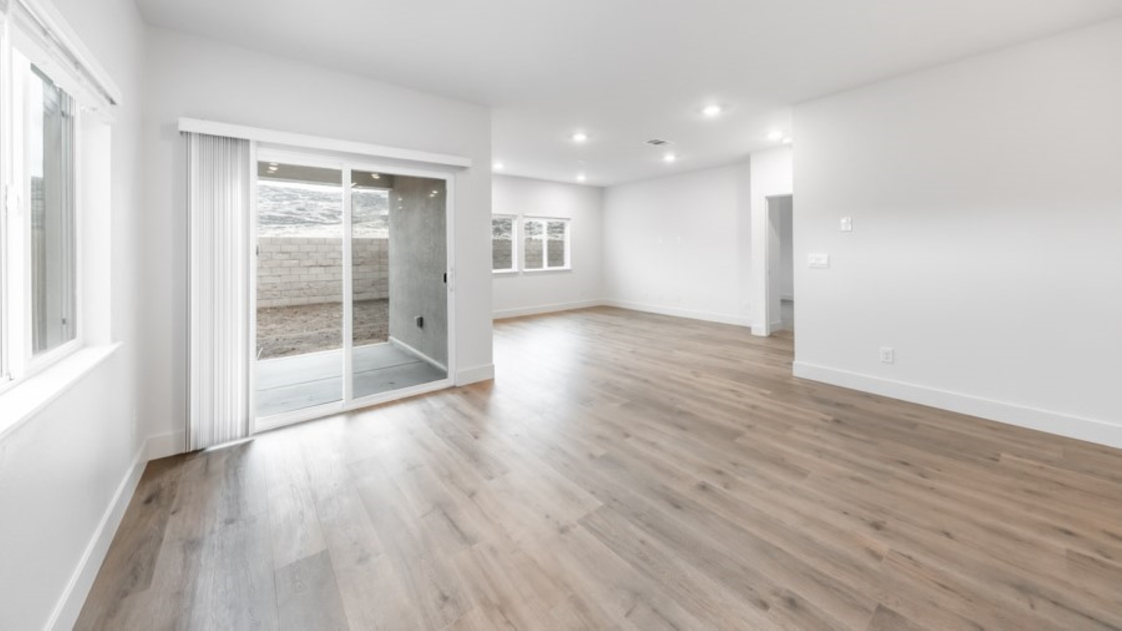 Dining area with access to back door looking into living room