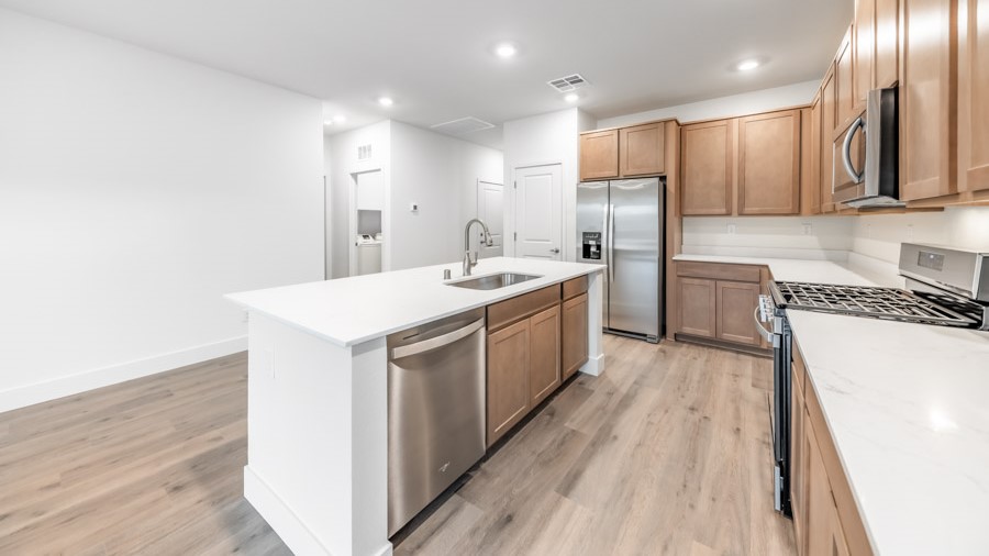 Kitchen island with sink and stainless steel dishwasher