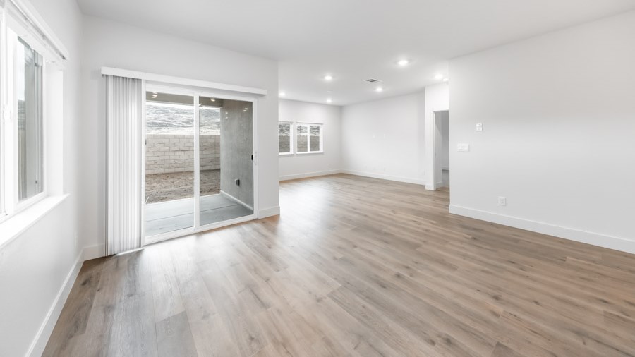 Dining area with access to back door looking into living room
