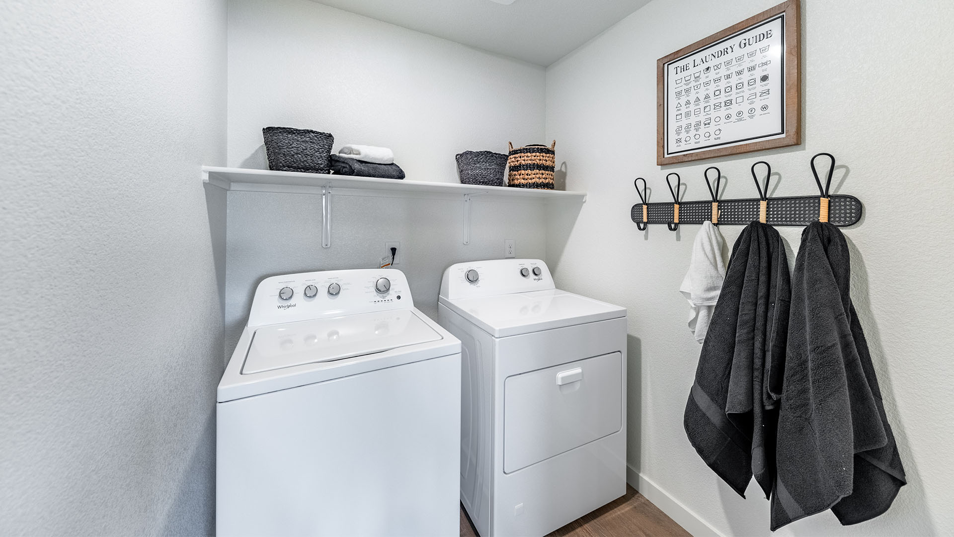 Separate laundry room with shelf above washing machine