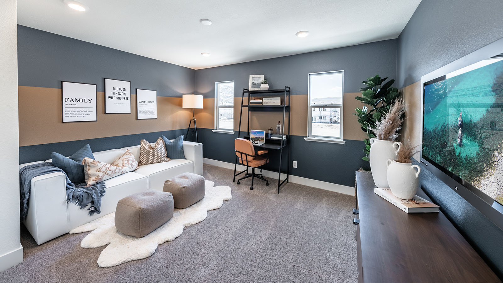 Open loft on second floor decorated as media room