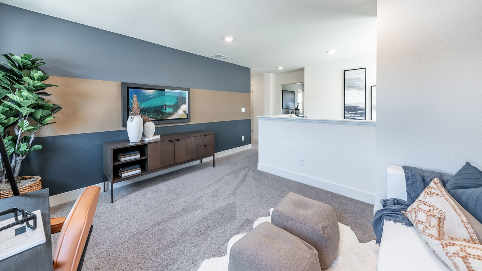 Loft decorated as a media room on second floor